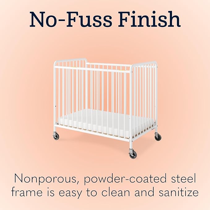 Foundations Chelsea Clearview Metal Compact Daycare Crib, 3" Casters, Compact Mini Size, Easy to Clean Durable Finish, Adjustable to Two Heights Mattress Board (White)