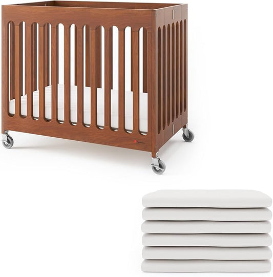Foundations Boutique Folding Hotel Crib and Sheet Bundle - Includes Wooden Mini Crib with 3" Foam Mattress (Cherry) and 6-Pack White Fitted Compact Sheets