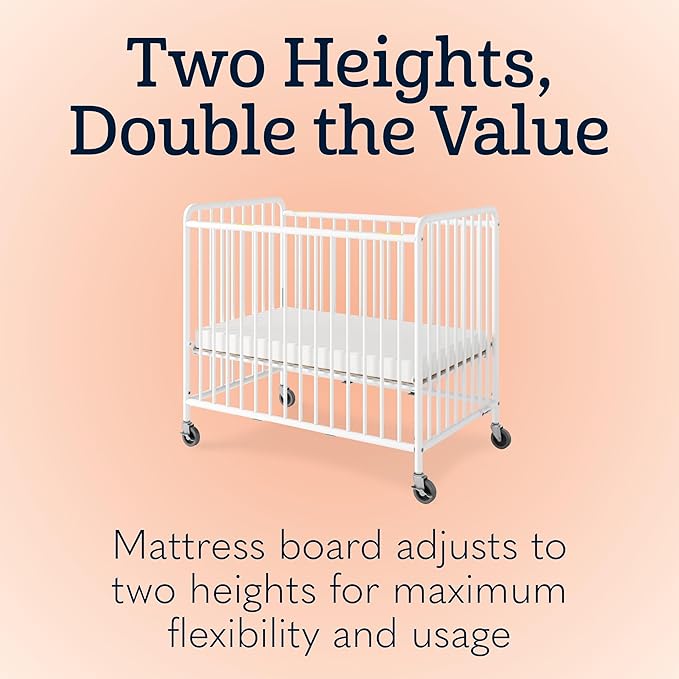Foundations Chelsea Clearview Metal Compact Daycare Crib, 3" Casters, Compact Mini Size, Easy to Clean Durable Finish, Adjustable to Two Heights Mattress Board (White)
