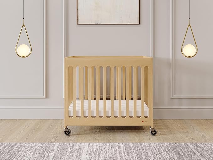 Foundations Boutique Folding Mini Baby Crib - Compact, Portable, Wooden Hotel Crib, Foldable Mini Cribs for Baby & Toddlers - Includes 3" Foam Mattress - Natural